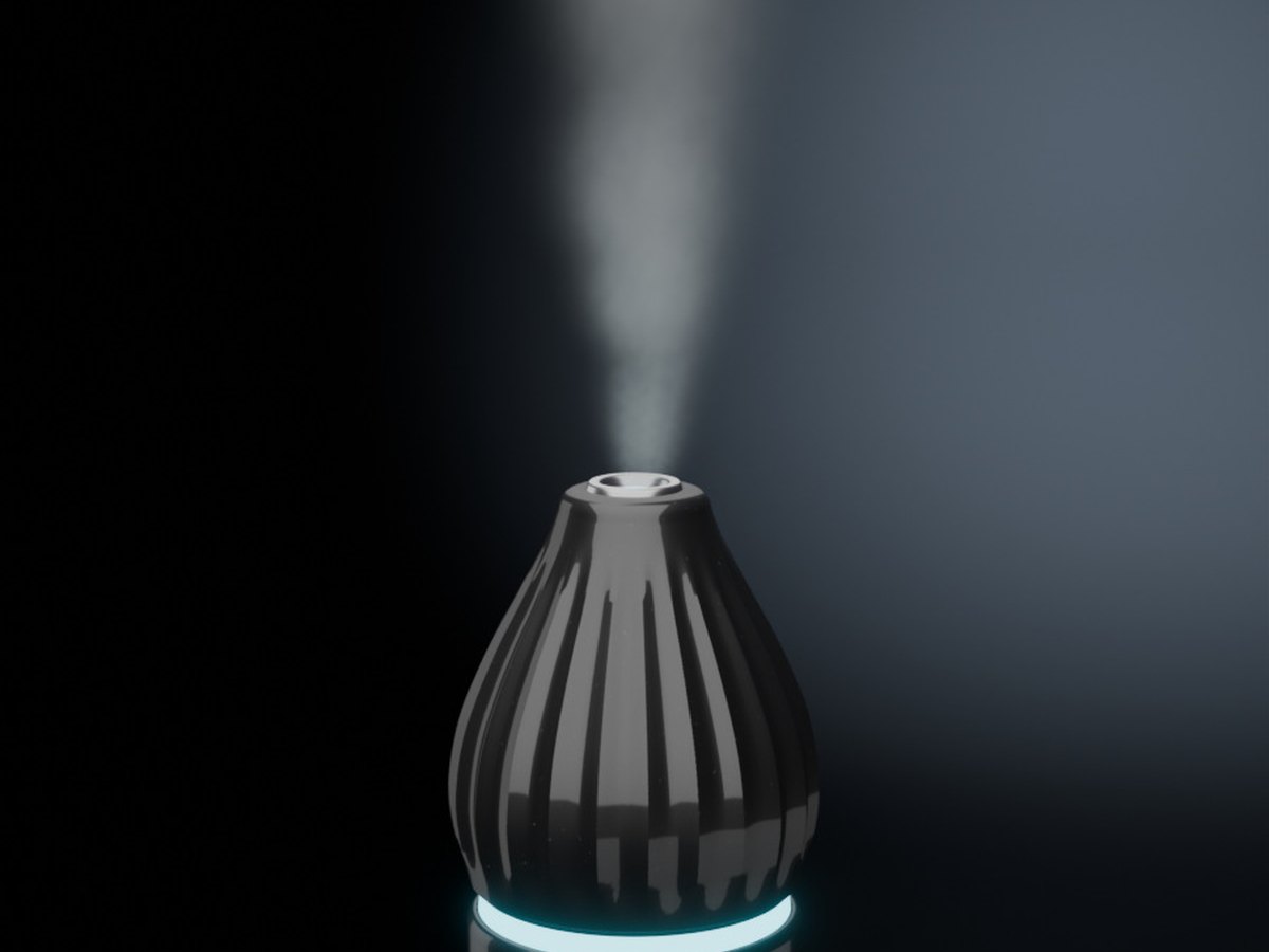 The diffuser with a cyan light and its mist